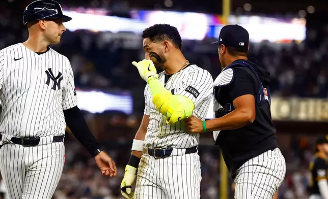 New York Yankees' José Caballero looks at Pittsburgh Pirates pitcher Dennis Santana after a scuffle during the ninth inning of a baseball game, Monday, July 20, 2026 in New York. (AP Photo/Noah K. Murray)