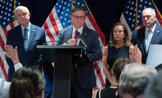 Speaker of the House Mike Johnson, R-La., flanked by Rep. Carlos Giménez R-Fla., from left, Chair of the House Republican Conference, Rep. Lisa McClain, R-Mich., and House Majority Leader Steve Scalise, R-La., speaks during a news conference on Capitol Hill, Tuesday, July 14, 2026, in Washington. (AP Photo/Jose Luis Magana)
