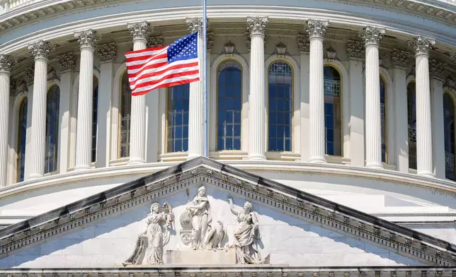 The U.S. flag flies at half-staff at the Capitol in Washington, Monday, July 13, 2026, after the sudden death of prominent Republican Senator Lindsey Graham of South Carolina. (AP Photo/Mariam Zuhaib)