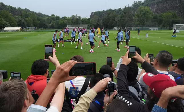 Journalists cover training session of England ahead of the World Cup round of 16 soccer match against Mexico, in Mexico City, Saturday, July 4, 2026. (AP Photo/Eduardo Verdugo)