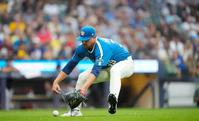 Milwaukee Brewers pitcher Chad Patrick fields a ground ball hit by Miami Marlins' Javier Sanoja during the sixth inning of a baseball game Friday, July 17, 2026, in Milwaukee. (AP Photo/Kayla Wolf)