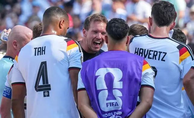 Germany head coach Julian Nagelsmann talks with his players at the hydration break during the World Cup round of 32 soccer match between Germany and Paraguay in Foxborough, Mass., near Boston, Monday, June 29, 2026. (AP Photo/Martin Meissner)
