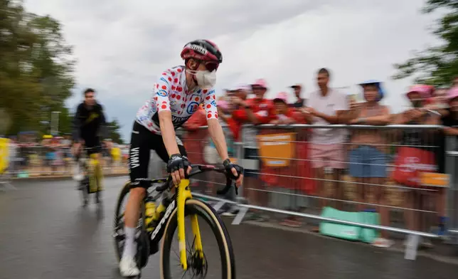 Denmark's Jonas Vingegaard, wearing the best climber's dotted jersey, arrives on the start line of the eleventh stage of the Tour de France cycling race with start in Vichy and finish in Nevers, France, Wednesday, July 15, 2026. (AP Photo/Mosa'ab Elshamy)