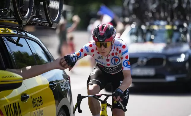 Denmark's Jonas Vingegaard, wearing the best climber's dotted jersey, rides during the ninth stage of the Tour de France cycling race with start in Malemort and finish in Ussel, France, Sunday, July 12, 2026. (AP Photo/Mosa'ab Elshamy)