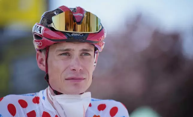 Denmark's Jonas Vingegaard, wearing the best climber's dotted jersey, waits for the start of the ninth stage of the Tour de France cycling race with start in Malemort and finish in Ussel, France, Sunday, July 12, 2026. (AP Photo/Mosa'ab Elshamy)