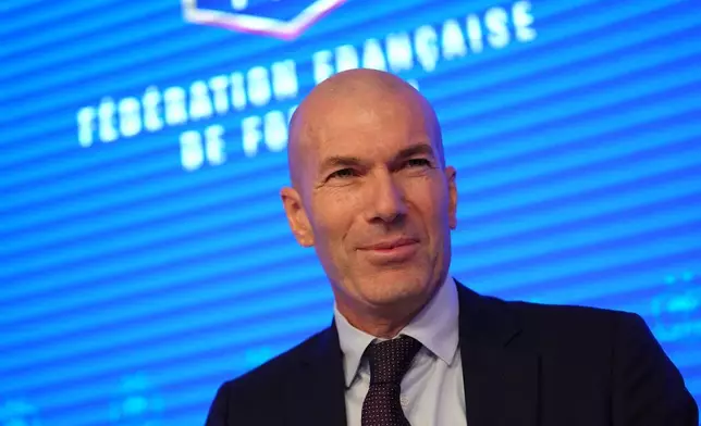 Zinedine Zidane, newly appointed coach of the France national soccer team, smiles during a media conference at the headquarters of French Football Federation headquarters in Paris, Tuesday, July 28, 2026. (AP Photo/Aurelien Morissard)