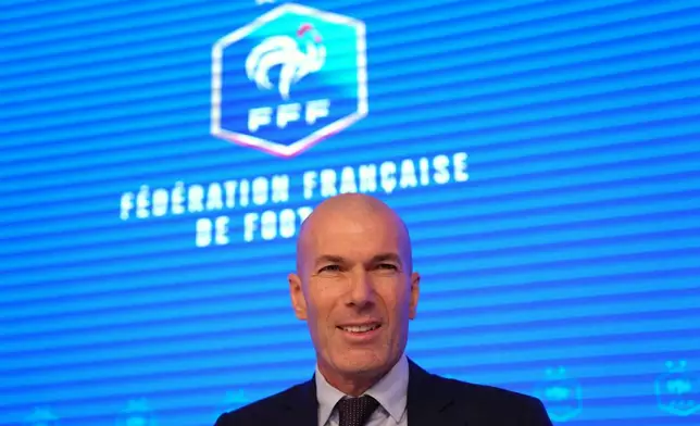 Zinedine Zidane, newly appointed coach of the France national soccer team, smiles during a media conference at the headquarters of French Football Federation headquarters in Paris, Tuesday, July 28, 2026. (AP Photo/Aurelien Morissard)