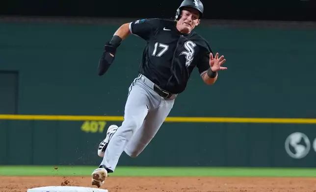 Chicago White Sox's Sam Antonacci rounds third base on his way to score on a double by Miguel Vargas during the third inning of a baseball game against the Texas Rangers, Monday, July 20, 2026, in Arlington, Texas. (AP Photo/LM Otero)