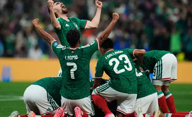 Mexico's Johan Vasquez, top left, celebrates with teammates after Raul Jimenez scored his side's second goal during the World Cup round of 32 soccer match against Ecuador in Mexico City, Tuesday, June 30, 2026. (AP Photo/Ricardo Mazalan)