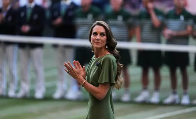 Britain Princess Kate applauds on centre court after presenting the trophies to Jannik Sinner of Italy and Alexander Zverev of Germany after their men's singles final at Wimbledon Tennis Championships in London, Sunday, July 12, 2026. (AP Photo/Kirsty Wigglesworth)
