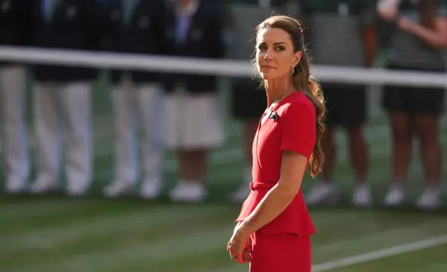 Britain's Princess Kate stands on the court to present the trophies after the women's singles final between Linda Noskova of Czech Republic and Karolina Muchova of Czech Republic, at Wimbledon Tennis Championships in London, Saturday, July 11, 2026. (AP Photo/Kin Cheung)