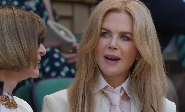Actor Nicole Kidman, right, and fashion editor Anna Wintour watche play in the women's doubles final at Wimbledon Tennis Championships in London, Sunday, July 12, 2026. (AP Photo/Kin Cheung)