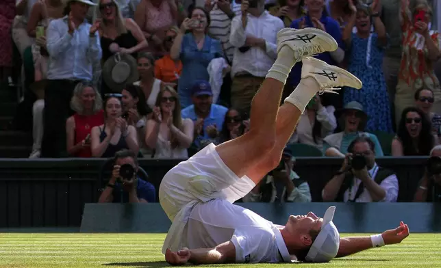 Arthur Fery of Britain reacts to winning against Flavio Cobolli of Italy in their quarter-final men's singles match at the Wimbledon Tennis Championships in London, Wednesday, July 8, 2026. (AP Photo/Brian Inganga)