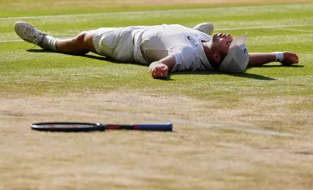 Arthur Fery of Britain reacts to winning against Flavio Cobolli of Italy in their quarter-final men's singles match at the Wimbledon Tennis Championships in London, Wednesday, July 8, 2026. (AP Photo/Maja Smiejkowska)