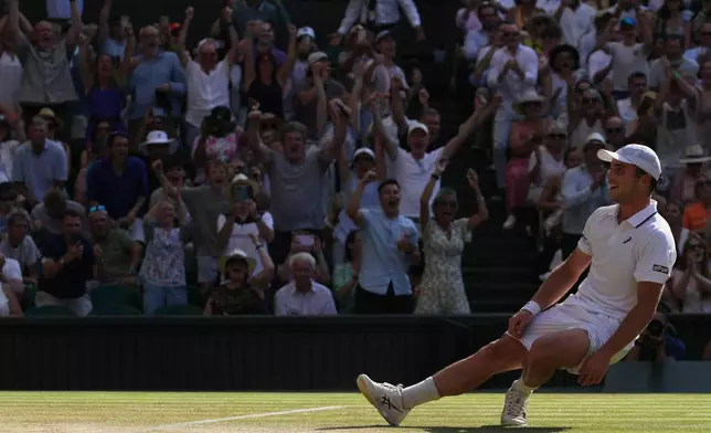 Arthur Fery of Britain reacts to winning against Flavio Cobolli of Italy in their quarter-final men's singles match at the Wimbledon Tennis Championships in London, Wednesday, July 8, 2026. (AP Photo/Brian Inganga)