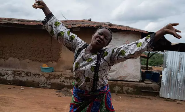 Aduke Balogun mother of Kehinde Kaosarat, a student that was kidnapped with others from a school by al-Qaida-linked fighters reacts after she was released in Esinele, Southwestern, Nigeria, July 17, 2026. (AP Photo/Pelumi Salako)