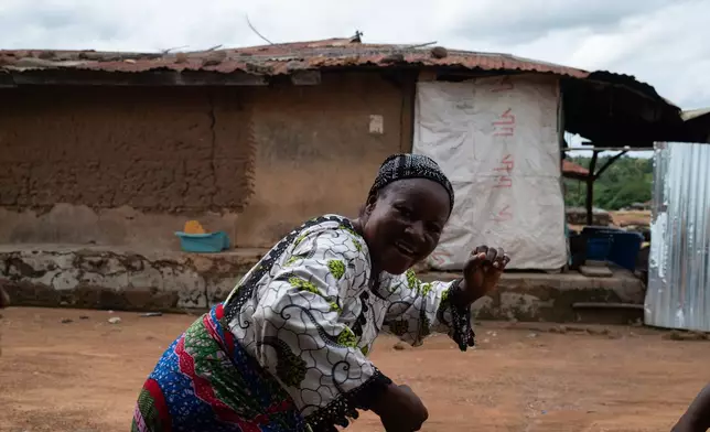 Aduke Balogun mother of Kehinde Kaosarat, a student that was kidnapped with others from a school by al-Qaida-linked fighters dances after she was released in Esinele, Southwestern, Nigeria, July 17, 2026. (AP Photo/Pelumi Salako)