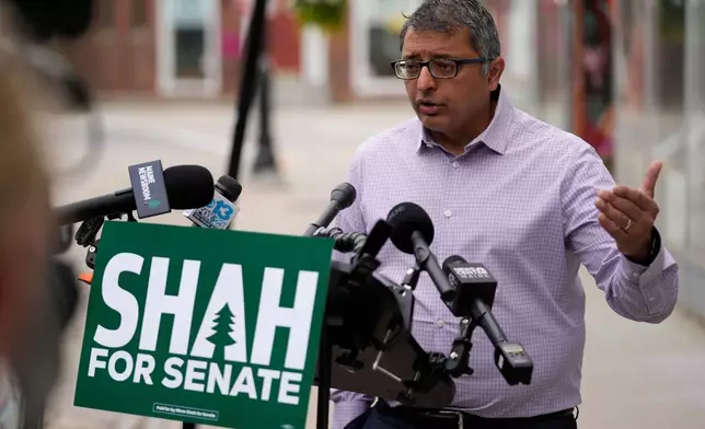 Dr. Nirav Shah, Democratic candidate for U.S. Senate, speaks to reporters a day after a shooting involving U.S. Immigration and Customs Enforcement, Tuesday, July 14, 2026 in Biddeford, Maine. (AP Photo/Robert F. Bukaty)