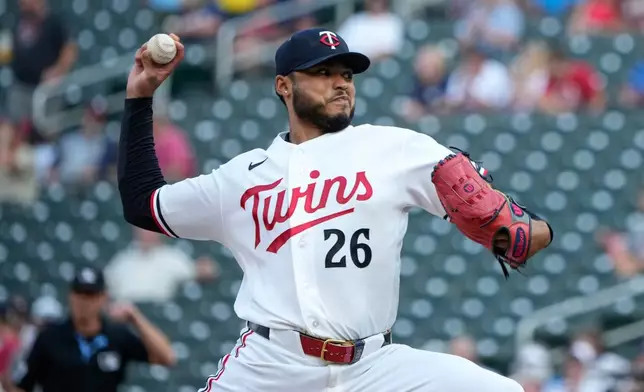 Minnesota Twins starting pitcher Taj Bradley (26) delivers during the first inning of a baseball game against the Kansas City Royals, Tuesday, July 28, 2026, in Minneapolis. (AP Photo/Joseph Scheller)
