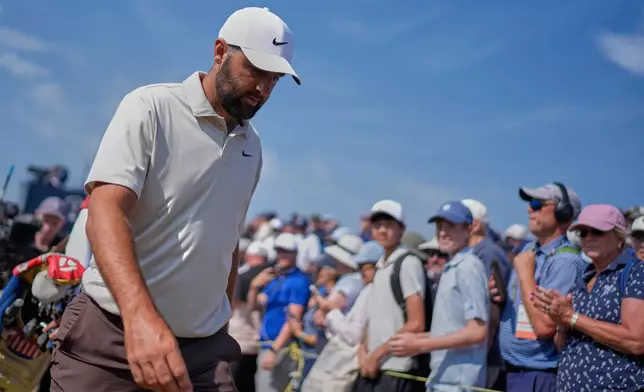 Scottie Scheffler of the United States walks to the 4th tee past applauding fans during the second day of the British Open Golf championships at Royal Birkdale golf club, in Southport, England, Friday, July 17, 2026. (AP Photo/David Goldman)