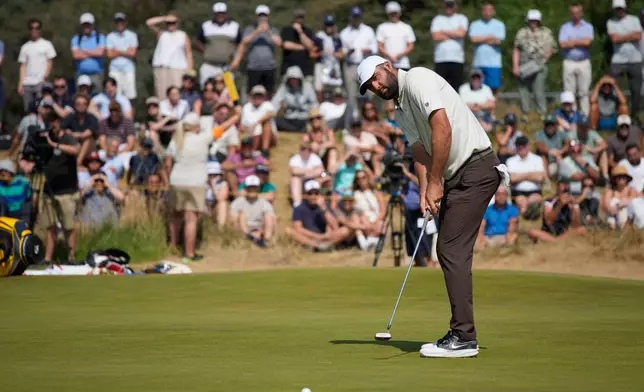 Scottie Scheffler of the United States putts on the 1st green during the second day of the British Open Golf championships at Royal Birkdale golf club, in Southport, England, Friday, July 17, 2026. (AP Photo/David Goldman)