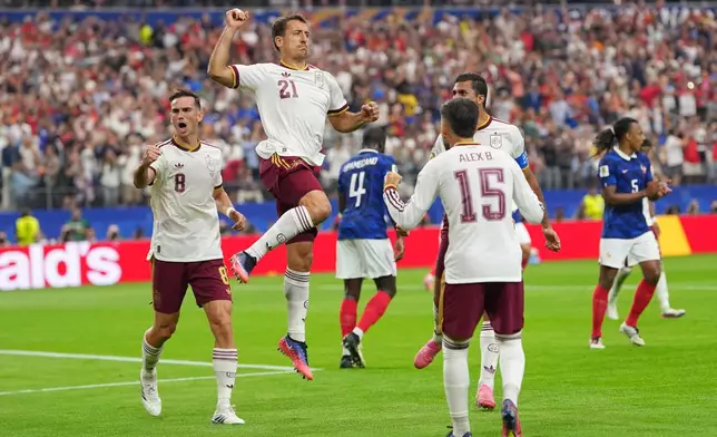 Spain's Mikel Oyarzabal celebrates scoring from the penalty spot the opening goal during a World Cup semifinal soccer match between France and Spain in Arlington, Texas, near Dallas, Tuesday, July 14, 2026. (AP Photo/Julio Cortez)