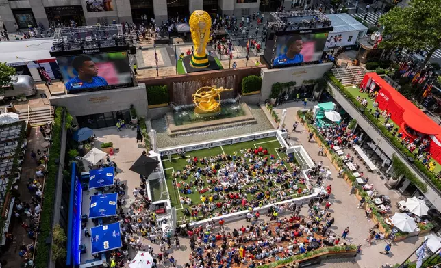 Fans prior to the World Cup semifinal soccer match between Spain and France at a watch party at the Rockefeller Center fan village, Tuesday, July 14, 2026, in New York. (AP Photo/Adam Gray)