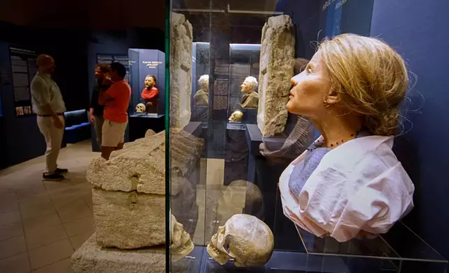 Roman-era skulls and their facial reconstructions are on display at the Aquincum Museum's exhibition titled "Once we were like you" which showcases characters and the fictional life stories of those who once lived in the bustling Roman settlement of Aquincum, in Budapest, Hungary, Tuesday, July 7, 2026. (AP Photo/Bela Szandelszky)
