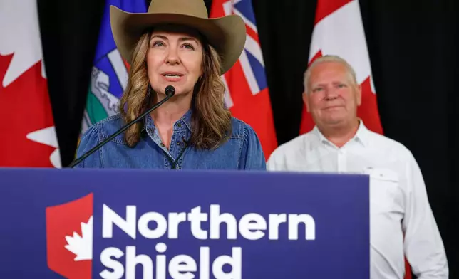 Alberta Premier Danielle Smith, left, and Ontario Premier Doug Ford announce the Northern Shield pipeline proposal in Calgary, Canada, Monday, July 6, 2026. (Jeff McIntosh/The Canadian Press via AP)