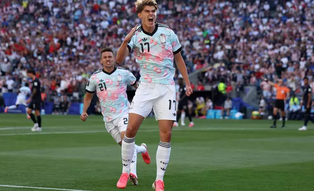 Belgium's Charles De Ketelaere (17) celebrates after scoring his side's opening goal during the World Cup round of 16 soccer match between the United States and Belgium in Seattle, Monday, July 6, 2026. (AP Photo/Maddy Grassy)