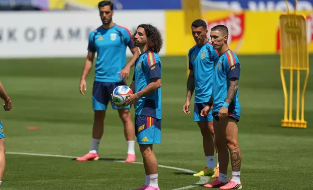 Spain's Marc Cucurella, center, and teammates attend a training session ahead of a World Cup quarterfinal soccer match against Belgium in Carson, Calif., Thursday, July 9, 2026. (AP Photo/Andre Penner)