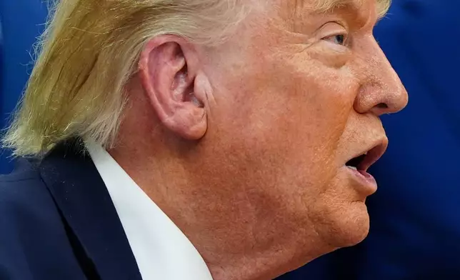President Donald Trump speaks about Dulles International Airport modernization, in the Oval Office of the White House, Wednesday, July 29, 2026, in Washington. (AP Photo/Julia Demaree Nikhinson)