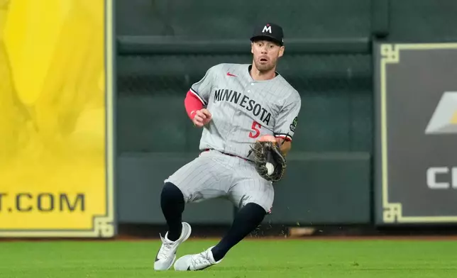 Minnesota Twins center fielder Ryan Kreidler catches a fly ball by Houston Astros' Isaac Paredes during the seventh inning of a baseball game Tuesday, June 30, 2026, in Houston. (AP Photo/David J. Phillip)