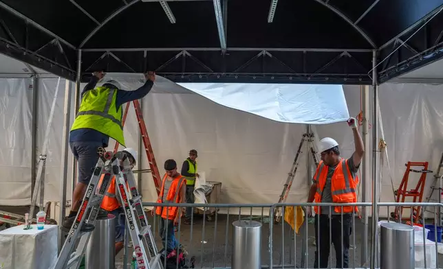 Workers set up a tent outside of Madison Square Garden ahead of a reported wedding between singer Taylor Swift and National Football League player Travis Kelce on Thursday, July 2, 2026, in New York. (AP Photo/Ryan Murphy)