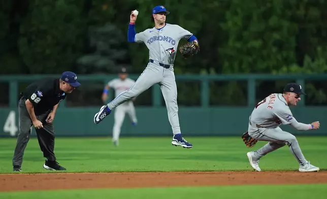 Toronto Blue Jays' Ernie Clement throws to first for an out by Los Angeles Dodgers' Andy Pages in the fifth inning during the MLB baseball All-Star Game between the American League and National League, Tuesday, July 14, 2026, in Philadelphia. (AP Photo/Matt Rourke)