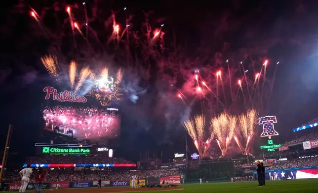 Fireworks explode during the MLB baseball All-Star Game between the American League and National League, Tuesday, July 14, 2026, in Philadelphia. (AP Photo/Matt Slocum)