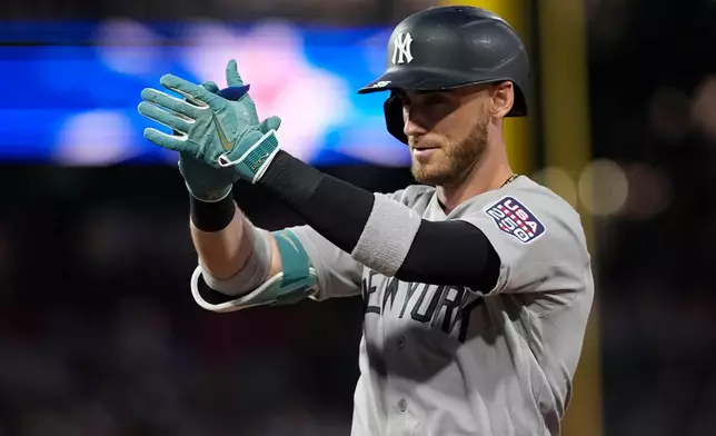 New York Yankees' Cody Bellinger reacts after hitting a two-run single against Philadelphia Phillies' Cristopher Sanchez in the first inning during the MLB baseball All-Star Game between the American League and National League, Tuesday, July 14, 2026, in Philadelphia. (AP Photo/Matt Slocum)