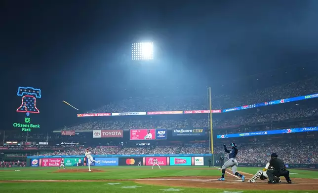 Tampa Bay Rays' Yandy Diaz loses control of the bat in the fifth inning during the MLB baseball All-Star Game between the American League and National League, Tuesday, July 14, 2026, in Philadelphia. (AP Photo/Matt Rourke)