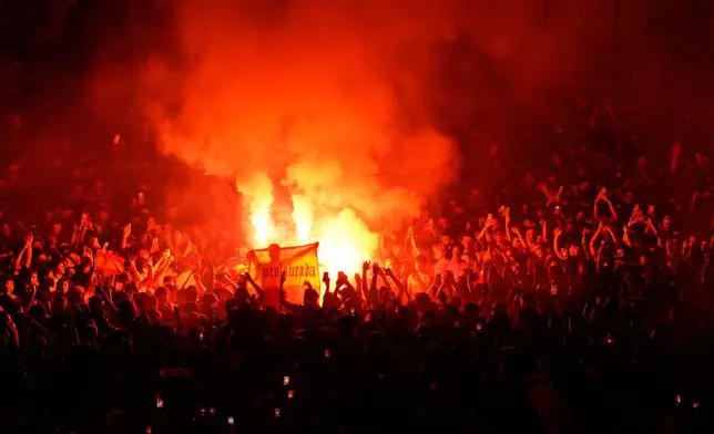 Fans hold flares during celebrations at Cibeles Square in Madrid on Monday, July 20, 2026, after Spain defeated Argentina in the World Cup final in East Rutherford, N.J., near New York. (AP Photo/Bernat Armangue)
