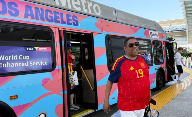 Fans exit a Metro shuttle after a World Cup match between Spain and Austria on Thursday, July 2, 2026, in Los Angeles. (AP Photo/Jaimie Ding)