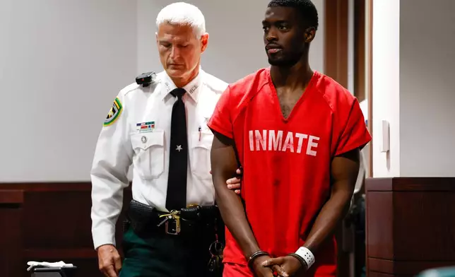 Terrion Arnold, a Detroit Lions cornerback, is brought out by a Hillsborough County officer before his pretrial detention hearing at the Hillsborough County Courthouse on Monday, June 29, 2026, in Tampa, Fla. (Jefferee Woo/Tampa Bay Times via AP)