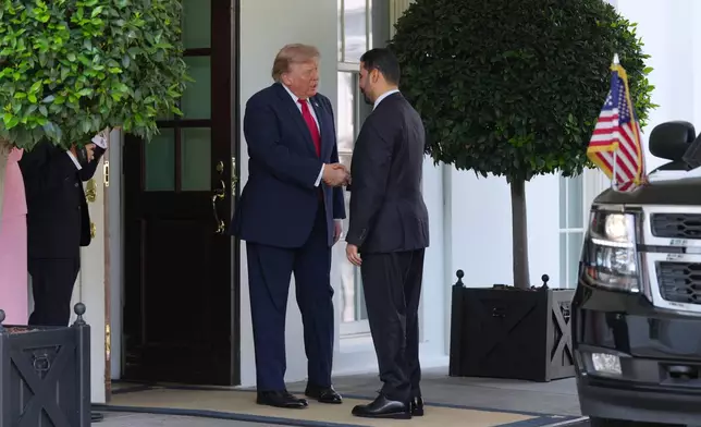 President Donald Trump greets Iraq's Prime Minister Ali al-Zaidi at the White House, Tuesday, July 14, 2026, in Washington. (AP Photo/Julia Demaree Nikhinson)