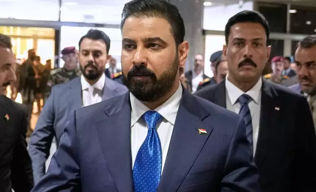 FILE - Iraq's Prime Minister-designate Ali al-Zaidi arrives at the Iraqi parliament to attend the voting of his government in Baghdad, Iraq, May 14, 2026. (AP Photo/Hadi Mizban, File)