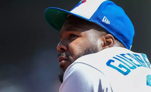 Toronto Blue Jays' Vladimir Guerrero Jr. looks on from the dugout after striking out in his first at bat against the Tampa Bay Rays during the first inning of a baseball game in Toronto, Thursday, July 23, 2026. (Nathan Denette/The Canadian Press via AP)