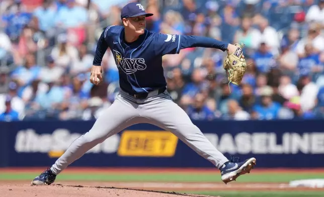 Tampa Bay Rays pitcher Casey Legumina pitches against the Toronto Blue Jays during the first inning of a baseball game in Toronto, Thursday, July 23, 2026. (Nathan Denette/The Canadian Press via AP)