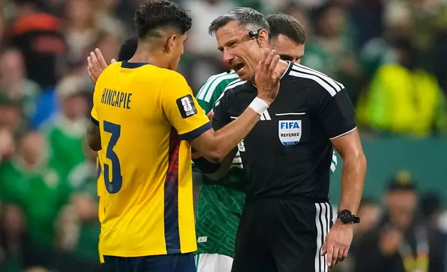 Referee Slavko Vincic of Slovenia speaks to Ecuador's Piero Hincapie (3) before sending him from the field during the World Cup round of 32 soccer match between Mexico and Ecuador in Mexico City, Tuesday, June 30, 2026. (AP Photo/Natacha Pisarenko)