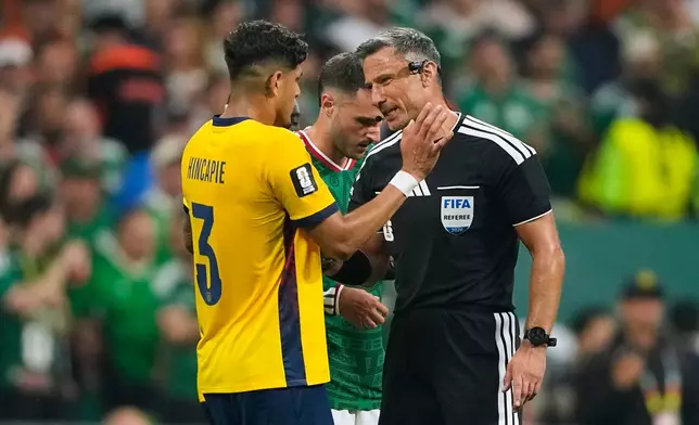 Referee Slavko Vincic of Slovenia speaks to Ecuador's Piero Hincapie (3) before sending him from the field during the World Cup round of 32 soccer match between Mexico and Ecuador in Mexico City, Tuesday, June 30, 2026. (AP Photo/Natacha Pisarenko)