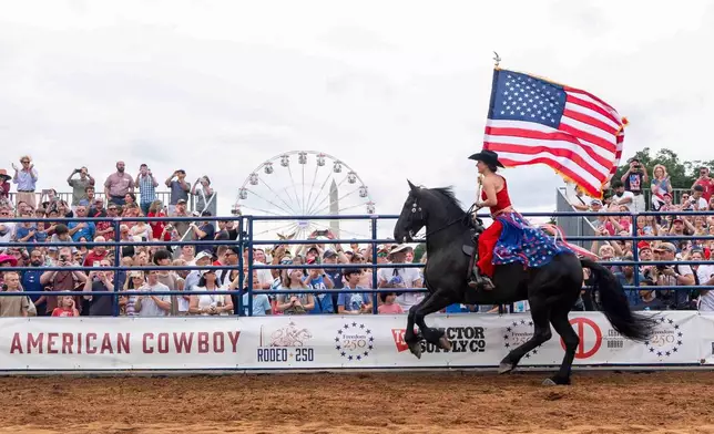 People watch Rodeo250 at the Great American State Fair on the National Mall, Saturday, June 27, 2026, in Washington. (AP Photo/Jen Golbeck)