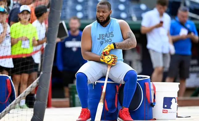 Toronto Blue Jays' Vladimir Guerrero Jr. waits his turn for batting practice before a baseball game against the Washington Nationals, Monday, July 27, 2026, in Washington. (AP Photo/John McDonnell)