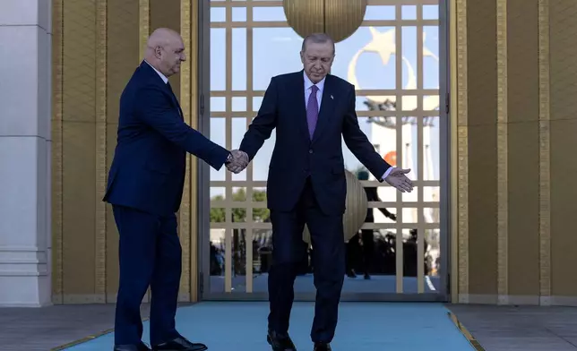 Turkish President Recep Tayyip Erdogan, right, shakes hands with his Lebanese counterpart Joseph Aoun before their meeting at the presidential palace in Ankara, Thursday, July 30, 2026. (Ugur Yildirim/DIA Photo via AP)